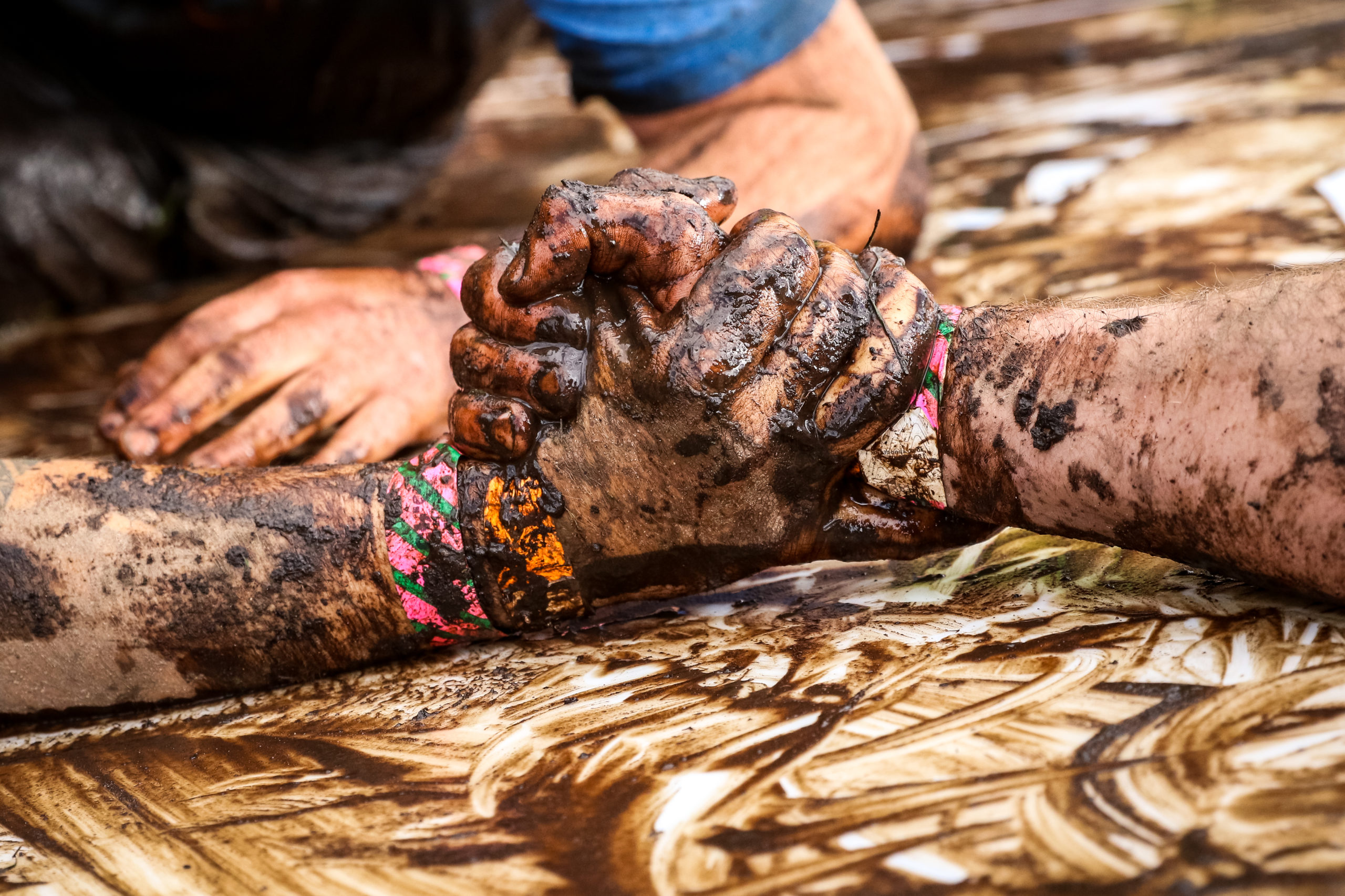 Participants' hands holding each other